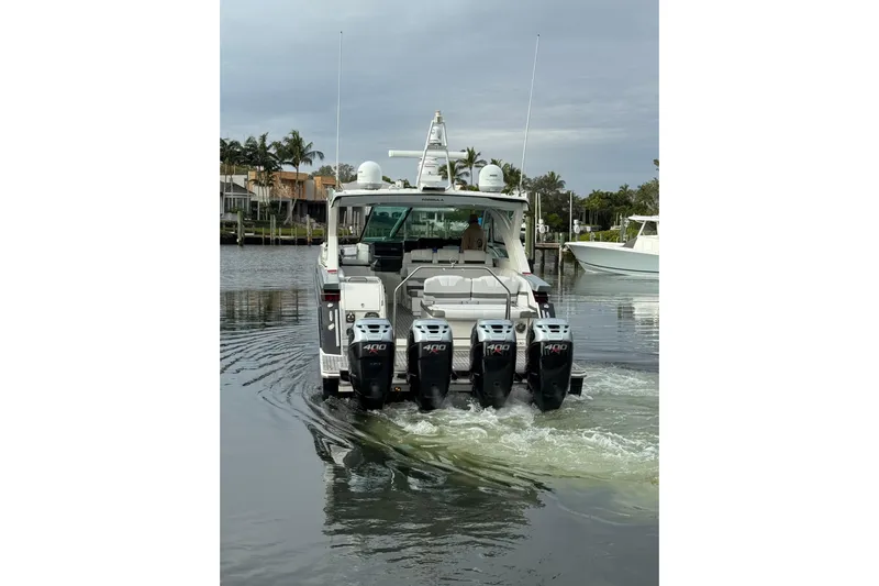  Yacht Photos Pics 2018 Formula 430 Super Sport Crossover boat with four outboard engines on water.