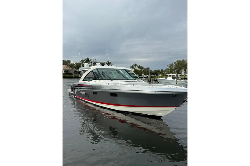  Yacht Photos Pics 2018 Formula 430 Super Sport Crossover boat on calm water, overcast sky.