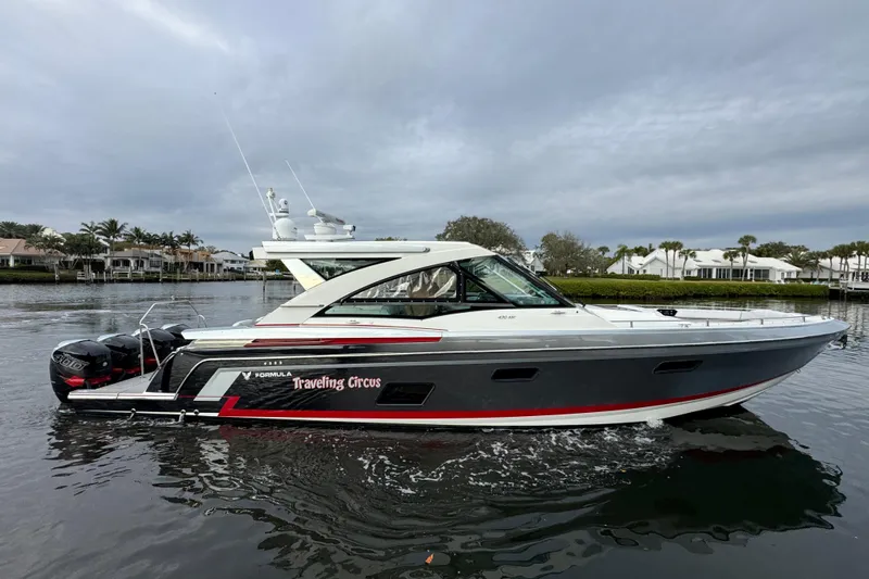  Yacht Photos Pics 2018 Formula 430 Super Sport Crossover boat on calm water, overcast sky.