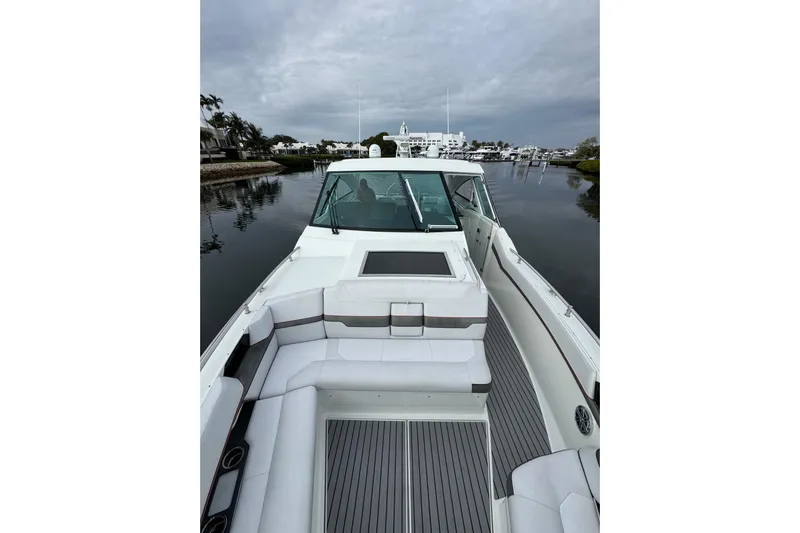  Yacht Photos Pics 2018 Formula 430 Super Sport Crossover boat on calm water, featuring spacious seating.