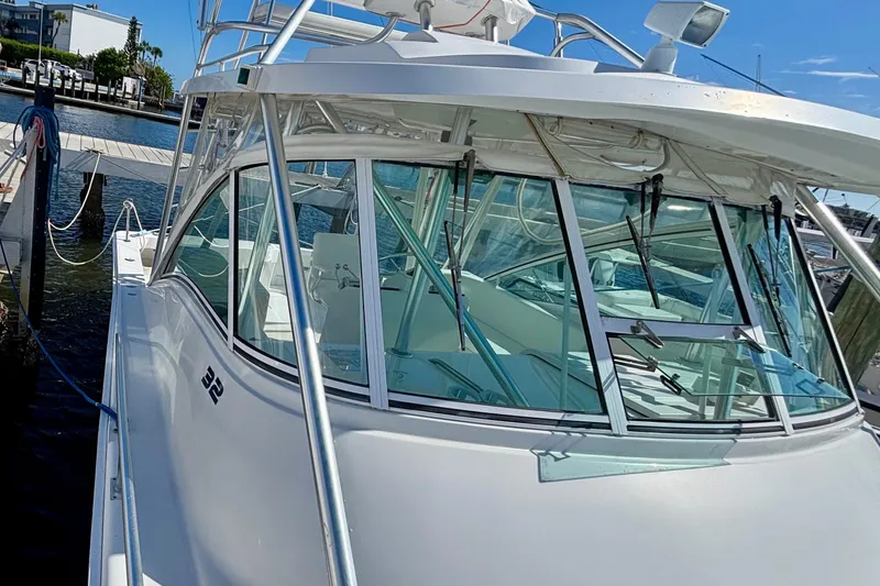  Yacht Photos Pics 2002 Luhrs 32 Open boat docked, showcasing sleek design and spacious cabin.
