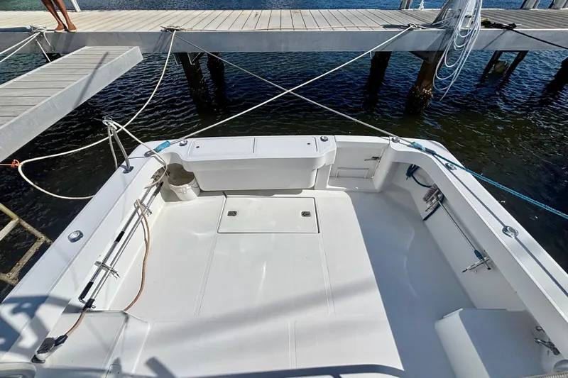  Yacht Photos Pics 2002 Luhrs 32 Open boat deck, docked with ropes, featuring spacious layout and clean design.