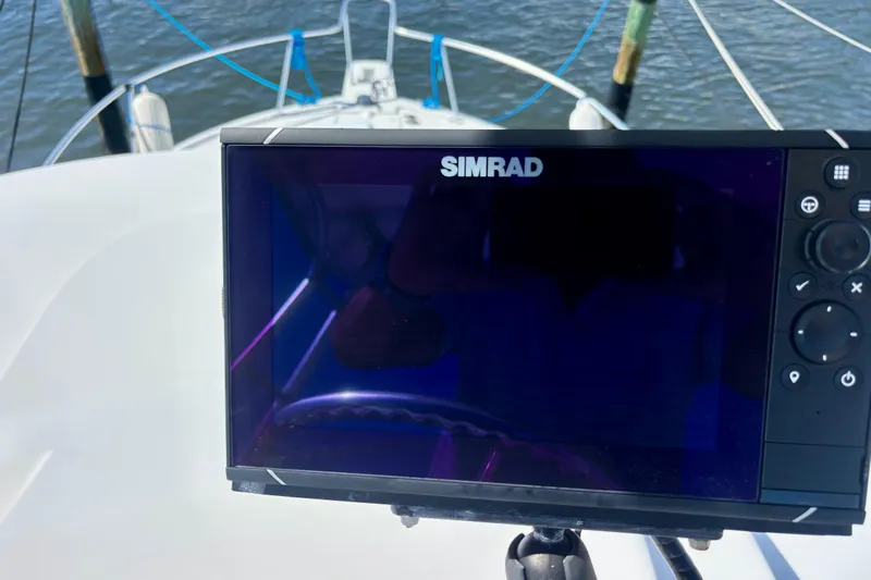  Yacht Photos Pics Simrad navigation system on 2002 Luhrs 32 Open boat, with water in the background.