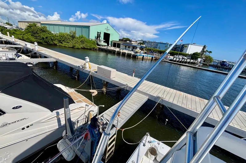  Yacht Photos Pics Marina view with boats docked, featuring a 2002 Luhrs 32 Open model.