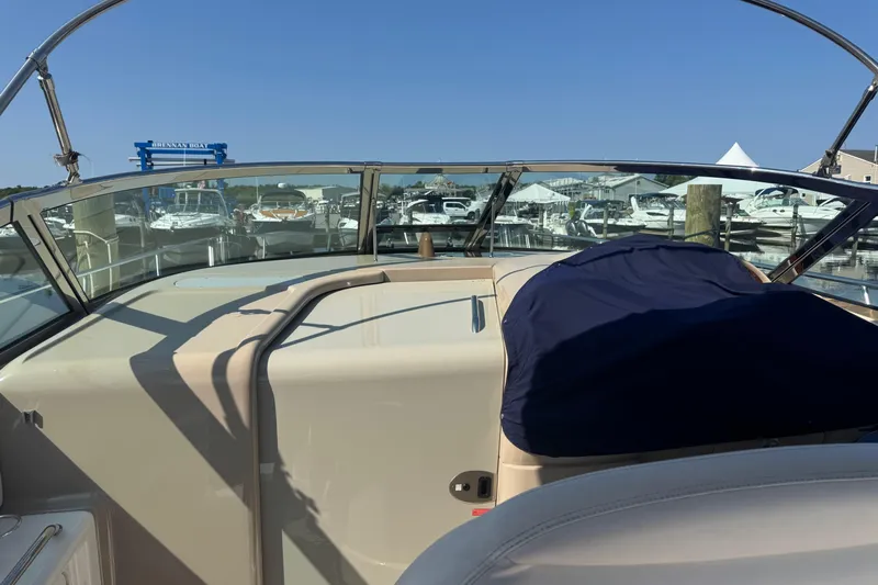  Yacht Photos Pics 2002 Sea Ray 360 Sundancer at marina, showcasing helm and seating area.