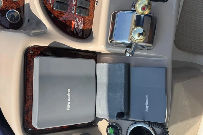  Yacht Photos Pics Control panel of a 2002 Sea Ray 360 Sundancer with Raymarine and Raytheon equipment.