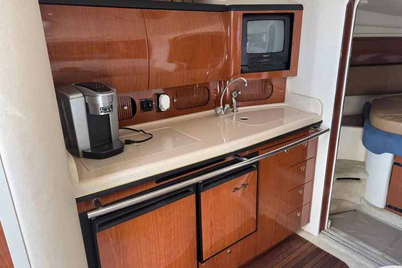  Yacht Photos Pics Luxurious 2002 Sea Ray 360 Sundancer yacht interior with kitchenette and modern amenities.