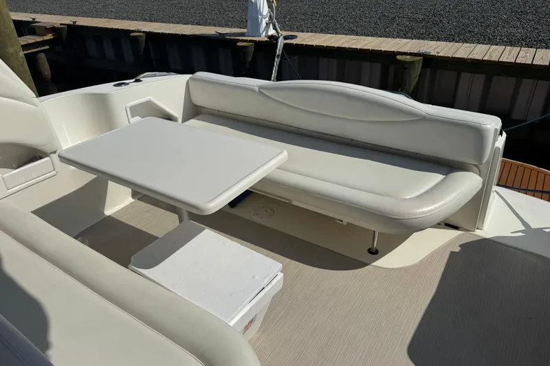  Yacht Photos Pics 2002 Sea Ray 360 Sundancer boat interior with white seating and table.