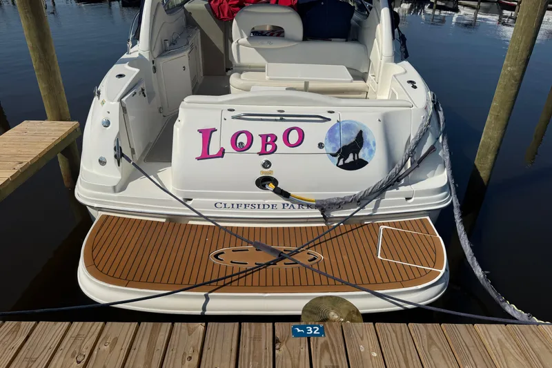  Yacht Photos Pics 2002 Sea Ray 360 Sundancer docked, featuring custom "Lobo" name and wolf graphic.