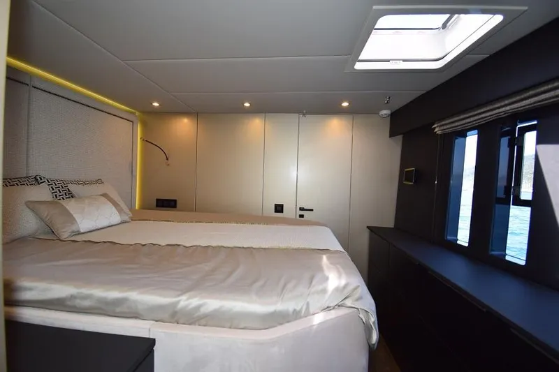 Welcome Back Yacht Photos Pics Luxurious bedroom interior of 2019 Sunreef 50 yacht with modern design and natural light.