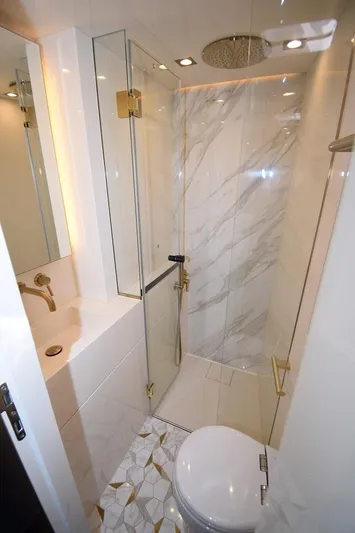 Welcome Back Yacht Photos Pics Luxurious bathroom in 2019 Sunreef 50 yacht with marble shower and modern fixtures.