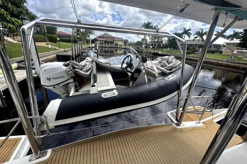  Yacht Photos Pics Leopard 44 yacht with Tohatsu engine docked in a scenic canal, 2016 model.