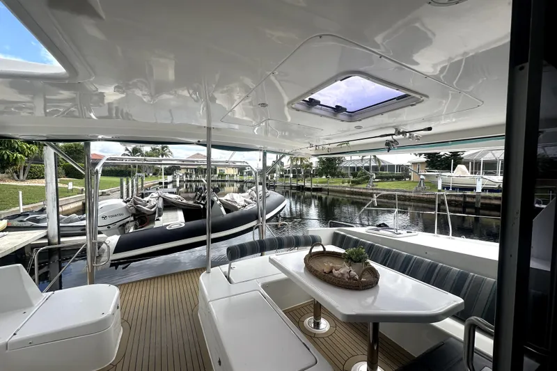  Yacht Photos Pics Spacious deck of 2016 Leopard 44 yacht with seating and waterfront view.