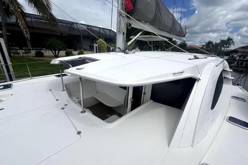  Yacht Photos Pics 2016 Leopard 44 catamaran deck with open hatch and sail cover.