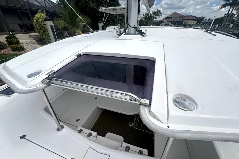  Yacht Photos Pics 2016 Leopard 44 yacht deck with open hatch, surrounded by tropical scenery.
