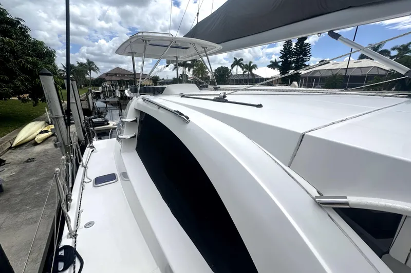  Yacht Photos Pics 2016 Leopard 44 catamaran docked, showcasing sleek design and spacious deck.