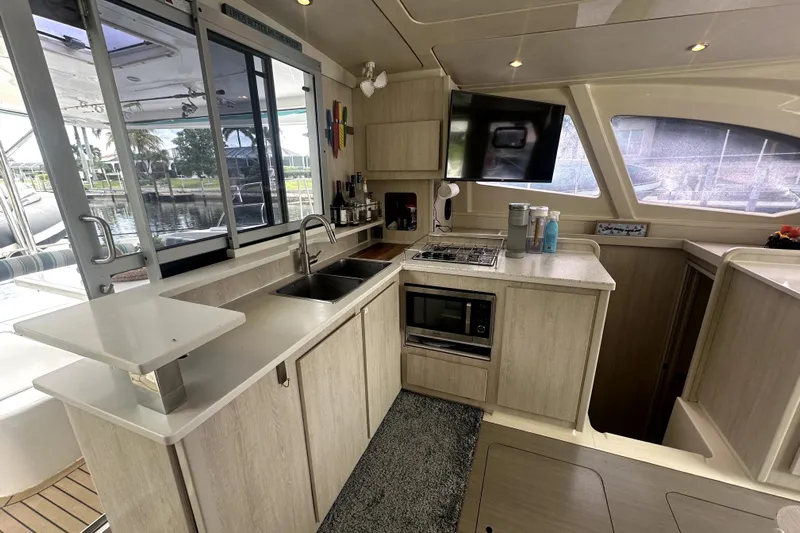  Yacht Photos Pics Modern kitchen interior on a 2016 Leopard 44 yacht, featuring appliances and ample counter space.
