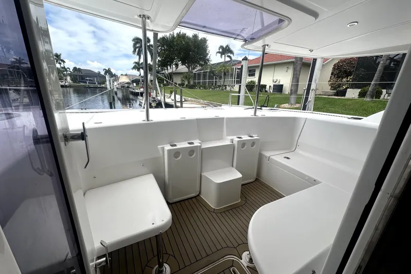  Yacht Photos Pics Spacious deck of 2016 Leopard 44 yacht with seating and scenic canal view.