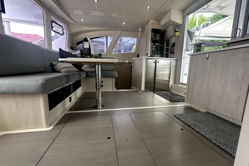  Yacht Photos Pics Luxurious interior of a 2016 Leopard 44 catamaran with modern seating and sleek design.