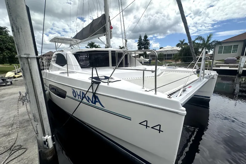  Yacht Photos Pics 2016 Leopard 44 catamaran docked, featuring sleek design and spacious deck.