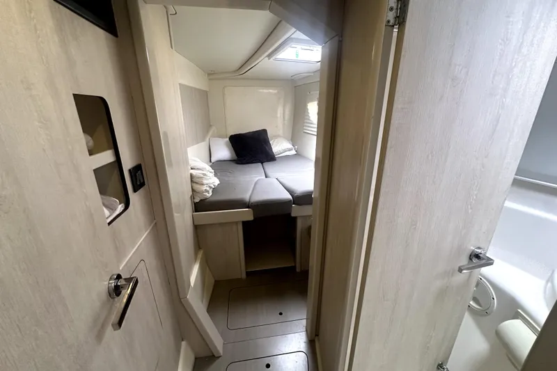  Yacht Photos Pics Cozy cabin interior of 2016 Leopard 44 yacht with bed and modern design.