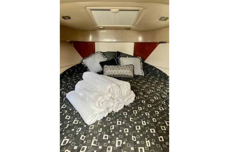  Yacht Photos Pics Luxurious cabin interior of 2011 Formula 37 PC with plush bedding and pillows.