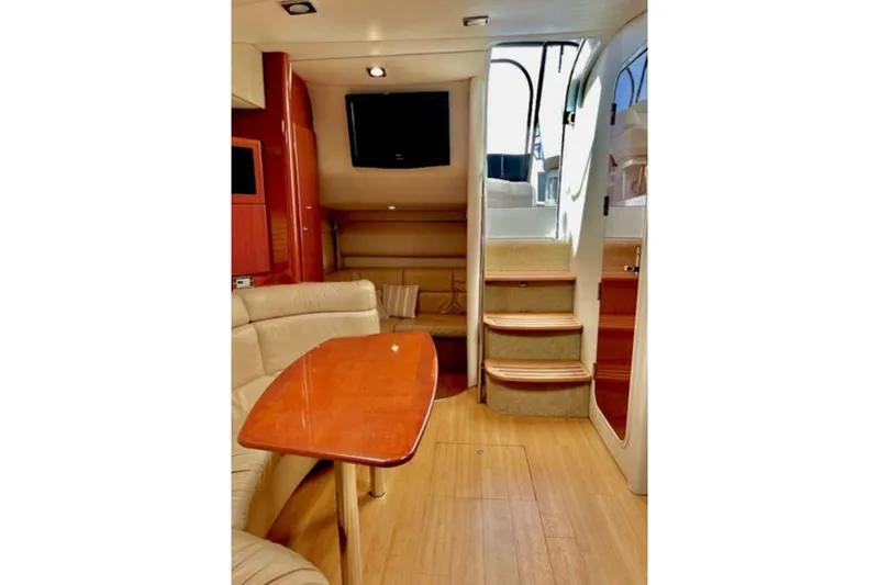  Yacht Photos Pics Luxurious interior of 2011 Formula 37 PC yacht with elegant seating and wooden table.