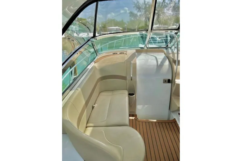  Yacht Photos Pics Interior of 2011 Formula 37 PC boat with beige seating and wood flooring.