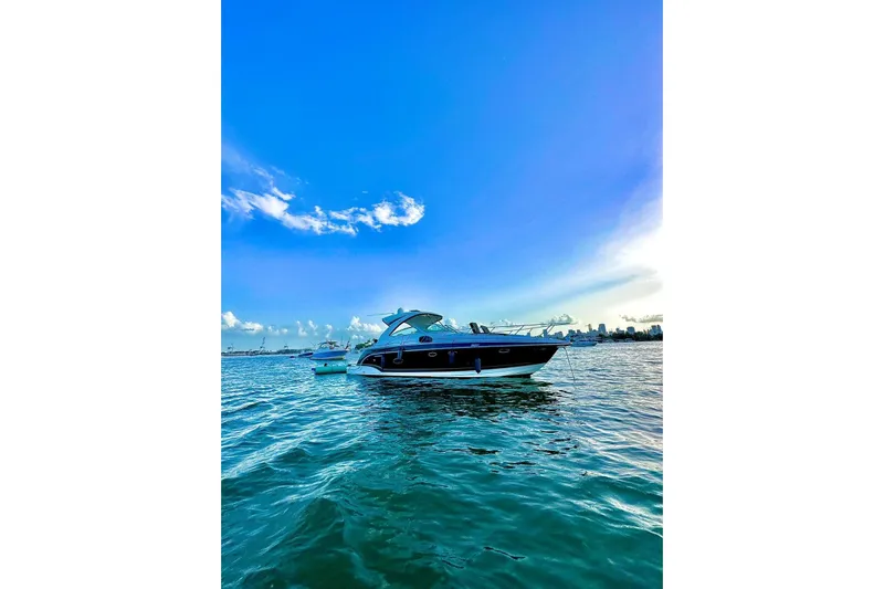  Yacht Photos Pics 2011 Formula 37 PC yacht on serene blue waters under a clear sky.