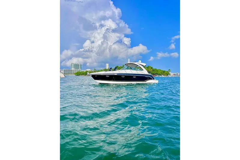  Yacht Photos Pics 2011 Formula 37 PC yacht cruising on clear blue waters under a vibrant sky.