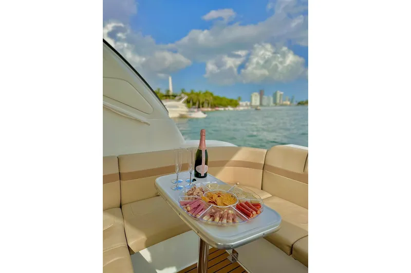  Yacht Photos Pics Luxurious 2011 Formula 37 PC yacht with charcuterie and champagne, scenic waterfront view.