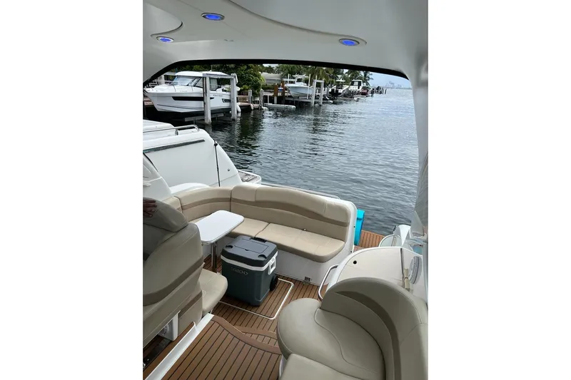  Yacht Photos Pics Interior view of 2011 Formula 37 PC yacht with seating and waterfront backdrop.