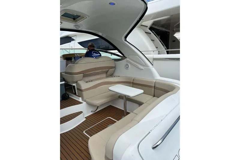  Yacht Photos Pics 2011 Formula 37 PC yacht interior with beige seating and wooden flooring.