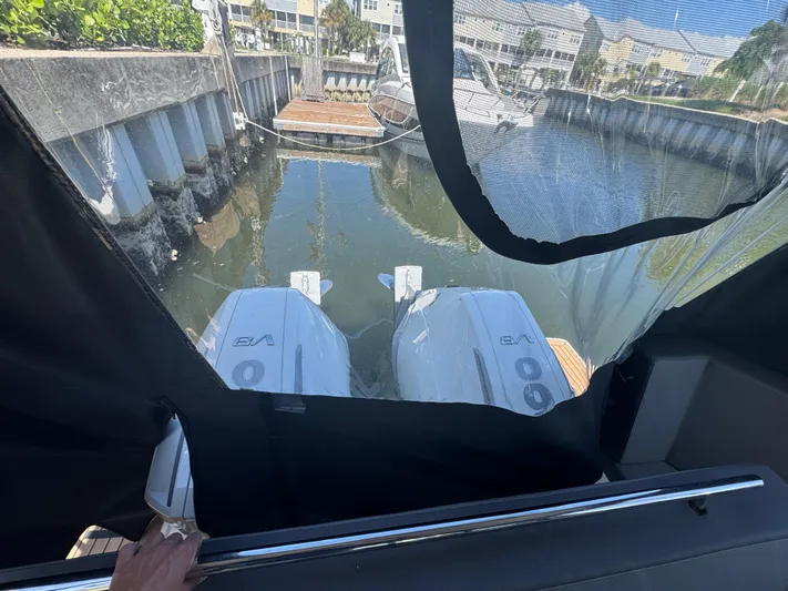  Yacht Photos Pics 2024 Beneteau Antares 11 with twin outboard engines docked in a marina.