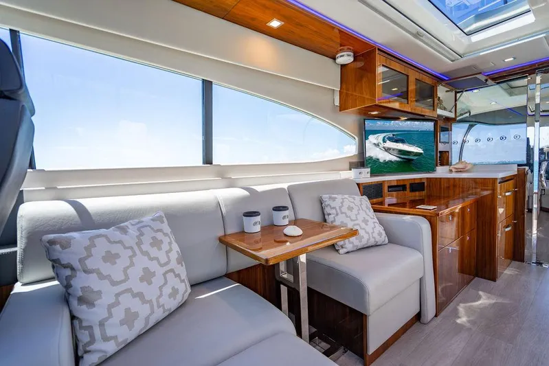 Bald Eagle Yacht Photos Pics Luxurious interior of 2024 Riviera 6000SY yacht with elegant seating and modern design.