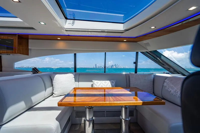 Bald Eagle Yacht Photos Pics Luxurious interior of 2024 Riviera 6000SY yacht with ocean view and skylight.