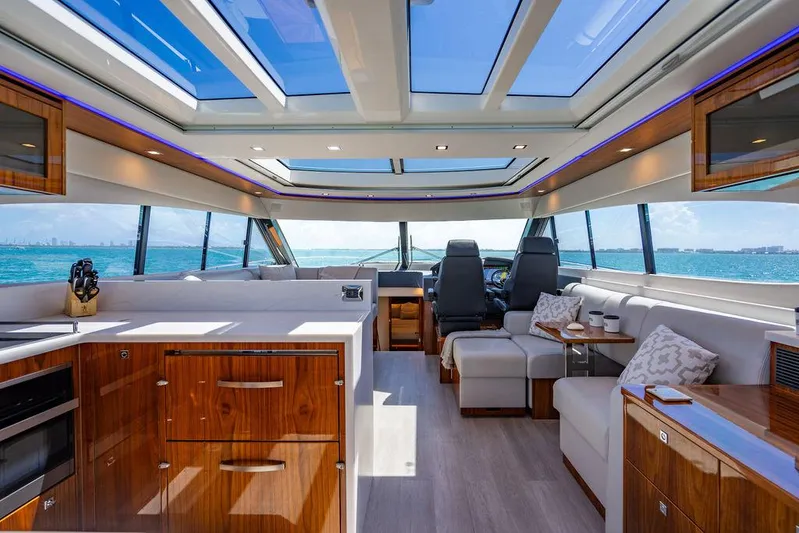 Bald Eagle Yacht Photos Pics Luxurious interior of 2024 Riviera 6000SY yacht with modern design and panoramic windows.