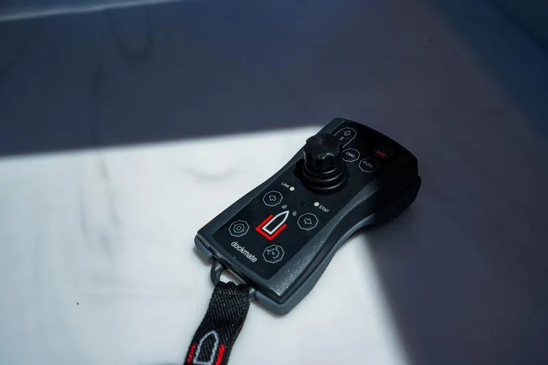 Bald Eagle Yacht Photos Pics Remote control for 2024 Riviera 6000SY yacht, featuring joystick and buttons.