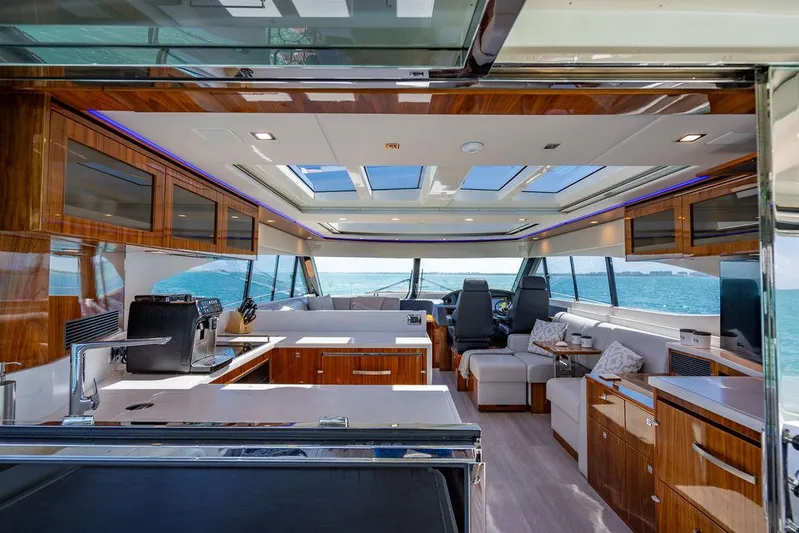 Bald Eagle Yacht Photos Pics Luxurious interior of 2024 Riviera 6000SY yacht with modern design and panoramic windows.