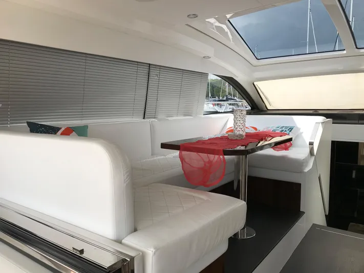  Yacht Photos Pics Luxurious interior of 2021 Fairline Targa 45 GT yacht with white seating and skylight.