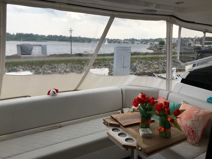  Yacht Photos Pics Luxurious interior of 2021 Fairline Targa 45 GT yacht with scenic waterfront view.