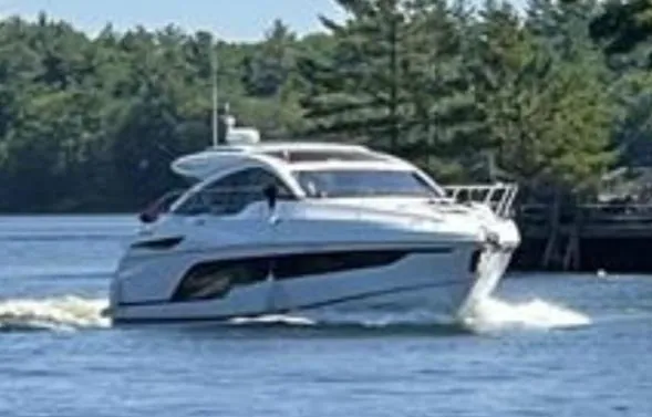  Yacht Photos Pics 2021 Fairline Targa 45 GT yacht cruising on a serene lake with lush forest backdrop.