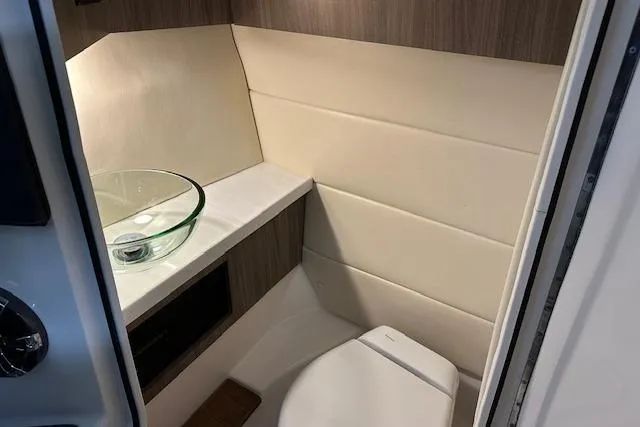  Yacht Photos Pics 2023 Regal 2800 Bowrider interior bathroom with modern sink and toilet.