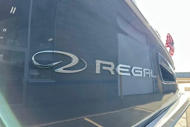  Yacht Photos Pics 2023 Regal 2800 Bowrider boat, close-up of logo on sleek exterior.