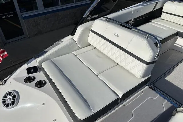  Yacht Photos Pics 2023 Regal 2800 Bowrider interior with white leather seating and cup holders.