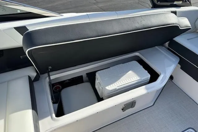  Yacht Photos Pics 2023 Regal 2800 Bowrider boat with open storage compartment and cooler.