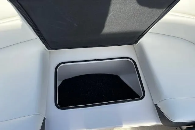  Yacht Photos Pics 2023 Regal 2800 Bowrider storage compartment with open lid, showcasing sleek design.
