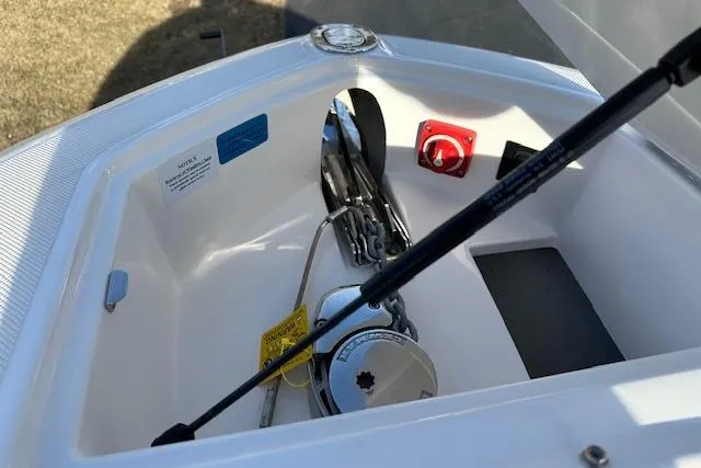  Yacht Photos Pics 2023 Regal 2800 Bowrider anchor compartment with chain and hydraulic support.