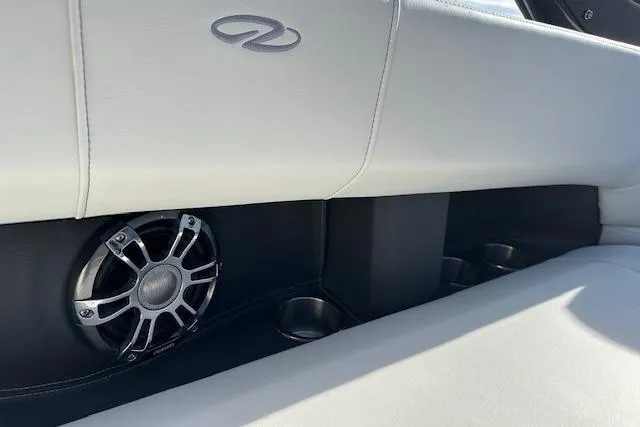  Yacht Photos Pics 2023 Regal 2800 Bowrider interior with speaker and cup holders, featuring sleek white upholstery.