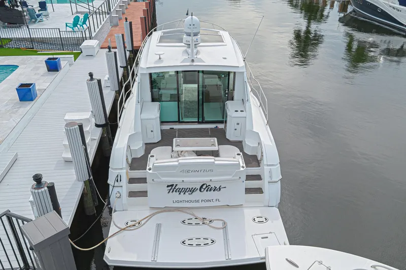 Low Hours!!! Yacht Photos Pics 2012 Cruisers Yachts 48 Cantius docked, rear view, in Lighthouse Point, FL marina.